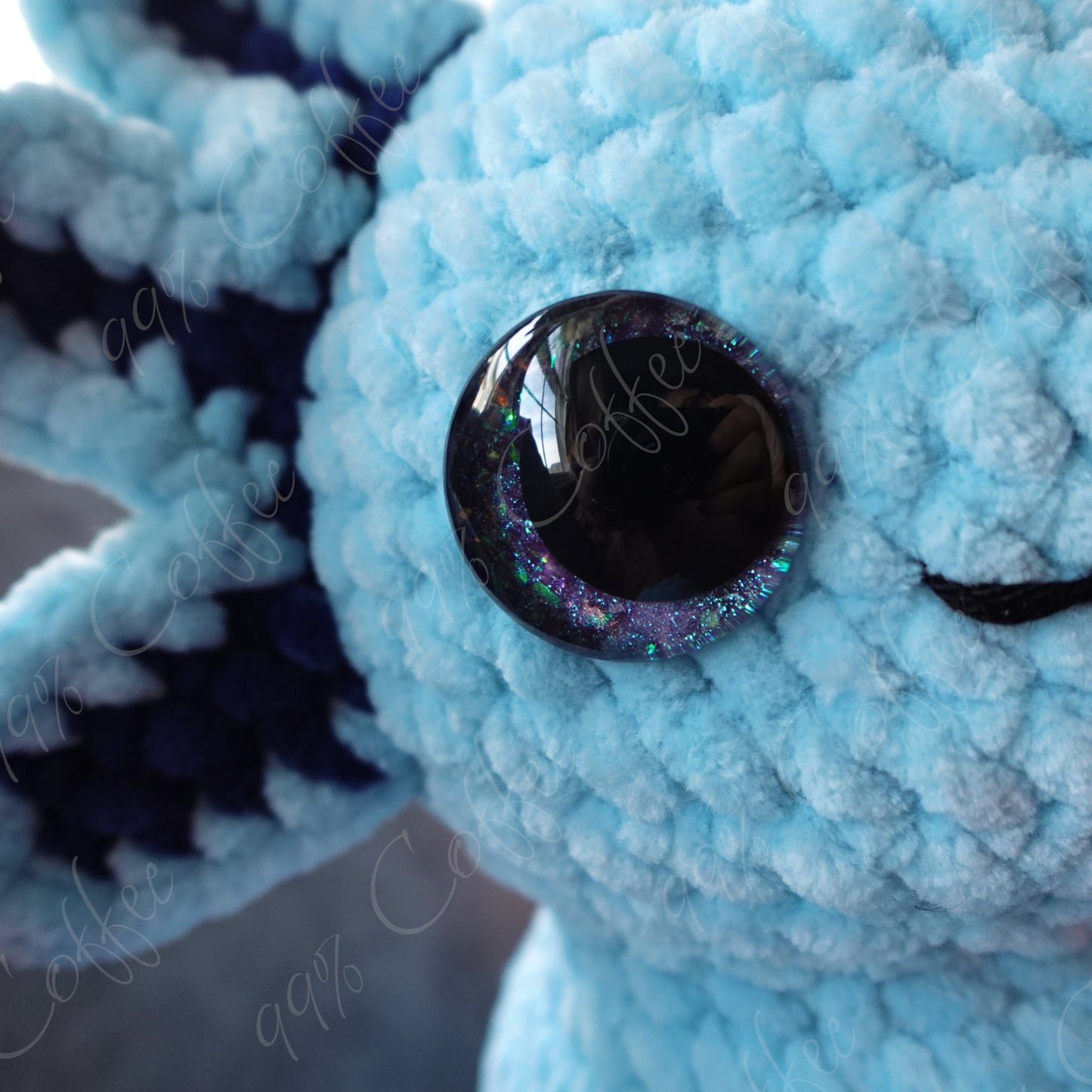 Blue sitting axolotl with custom glitter safety eyes - 99% Coffee