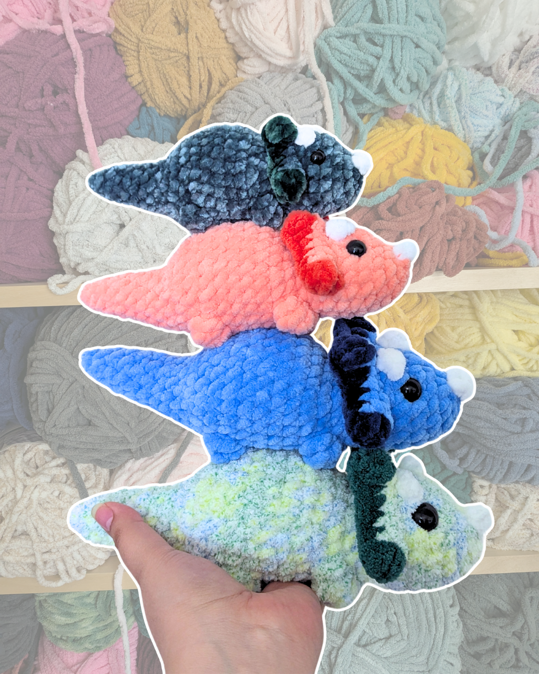 A stack of Snoot the Triceratops used for testing the crochet pattern